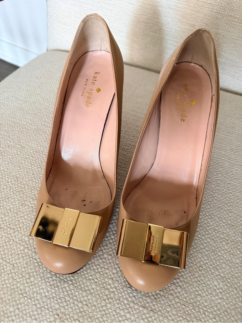 kate spade tan nude peep-toe pumps with gold bow hardware